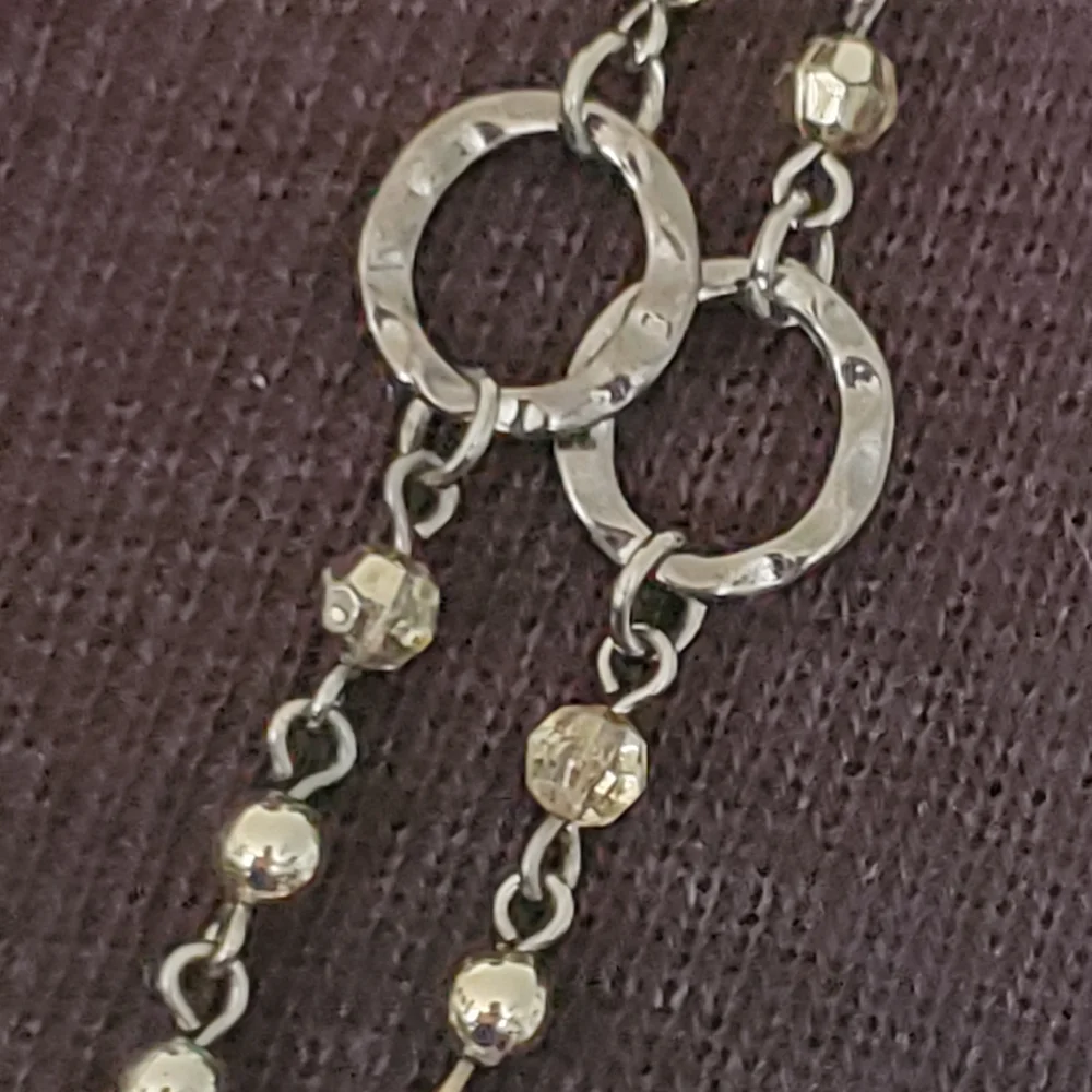 Silvertone and black bead and geometric stations necklace